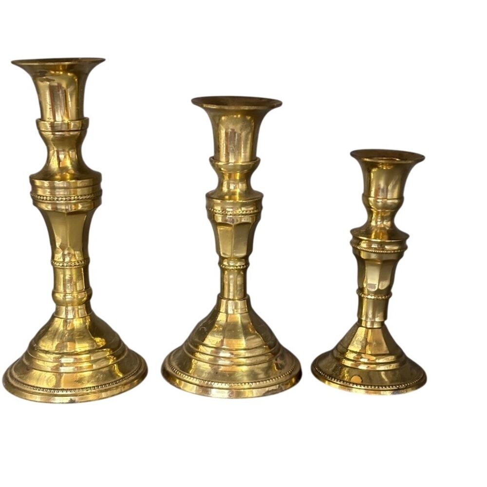 Three matching vintage brass candlesticks. Size 7", 6", 5"  wt . See photos